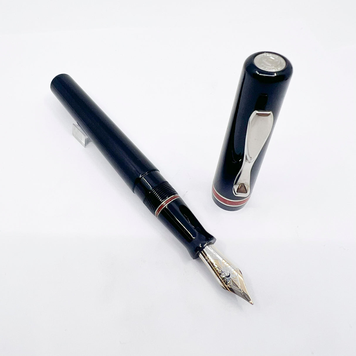 Visconti Glossy Black Resin Midnight Voyager Fountain Pen - Two Rings of Coral Celluloid - Broad 18kt Gold Nib