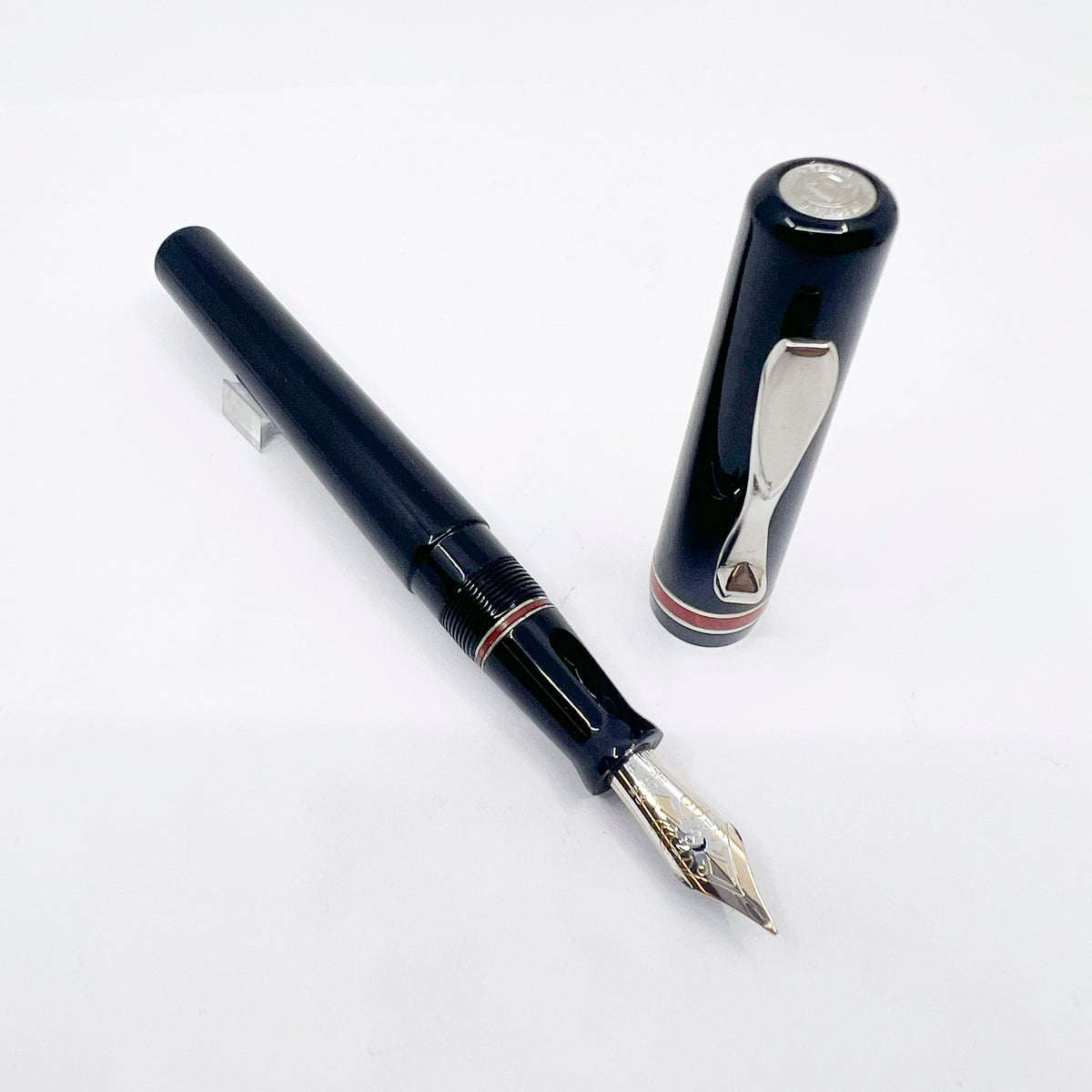 Visconti Glossy Black Resin Midnight Voyager Fountain  Pen - Two Rings of Coral Celluloid - Broad 18kt Gold Nib